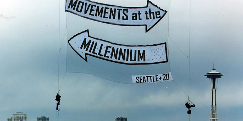 Photo of a Rainforest Action Network banner drop over Seattle, November 1999